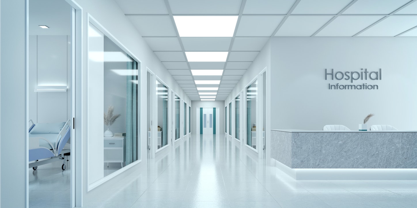 Empty corridor in modern clean hospital with information counter and hospital bed in rooms.3d rendering