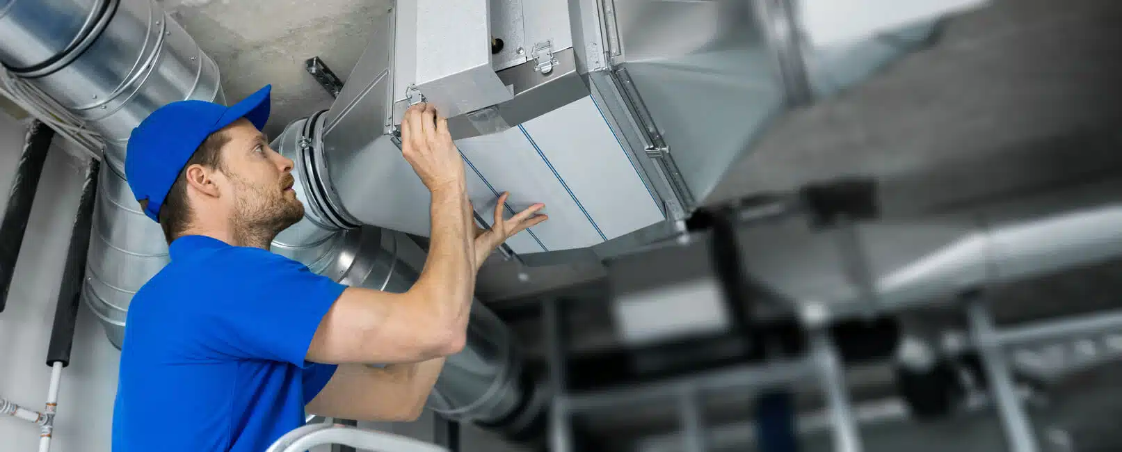 Hvac Technician Installing an Air Scrubber